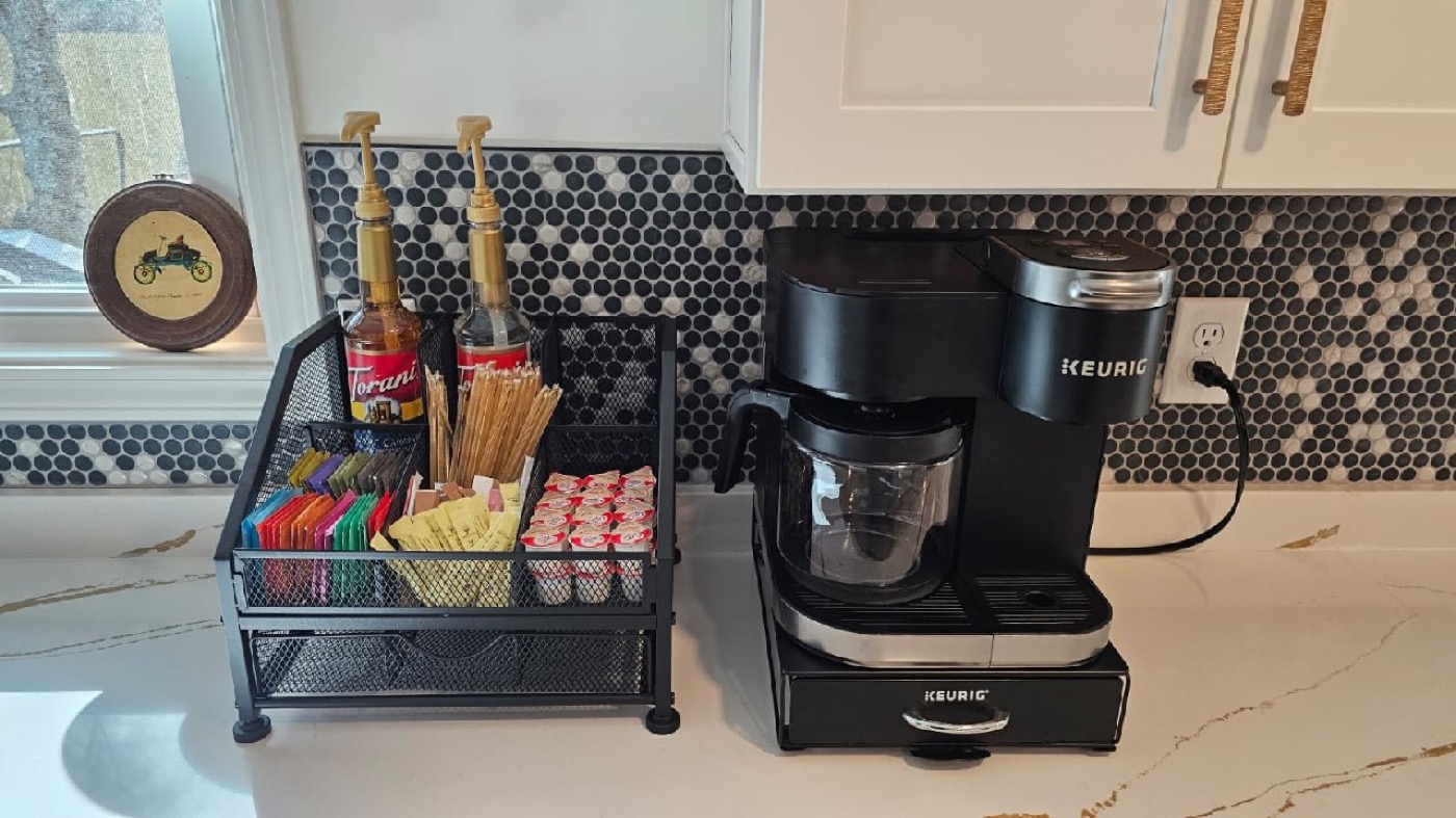 Coffee bar with Keurig, Torani syrups, creamer caddies, and assorted teas